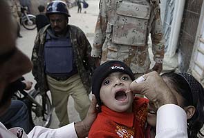 Polio vaccines in Pakistan. Note the guards.