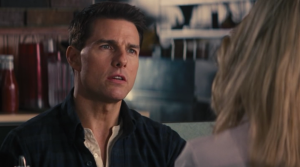 Tom Cruise as Jack Reacher, listing the "four types" to Rosamund Pike's Helen Rodin.